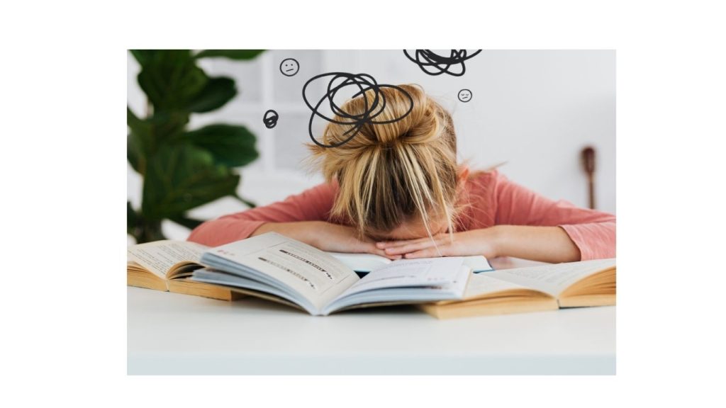 Female overwhelmed while studying