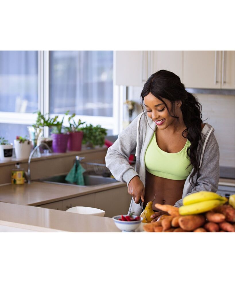 A lady preparing delicious fresh healthy food, showing how hypnotherapy can help you make the healthiest choices.