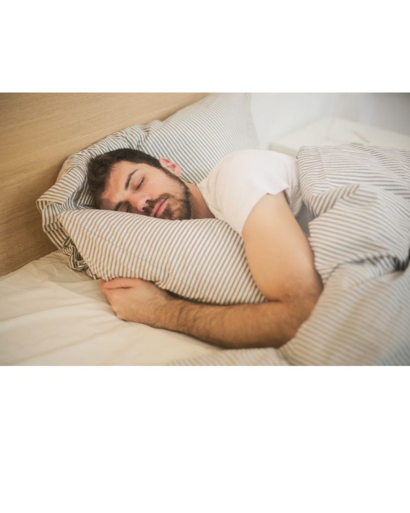 A picture of a man sleeping, Hypnotherapy can help you have a good night's sleep.