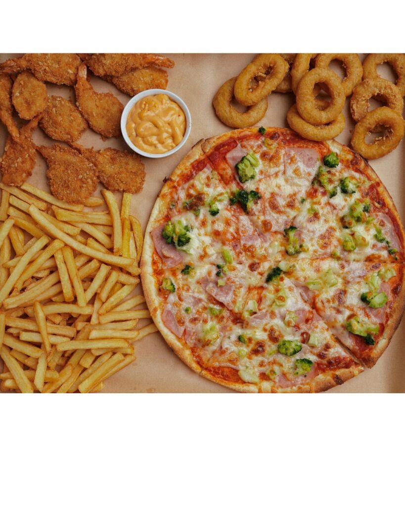 A picture of a mixture of junk food, hypnotherapy can help you make delicious healthy choices instead.