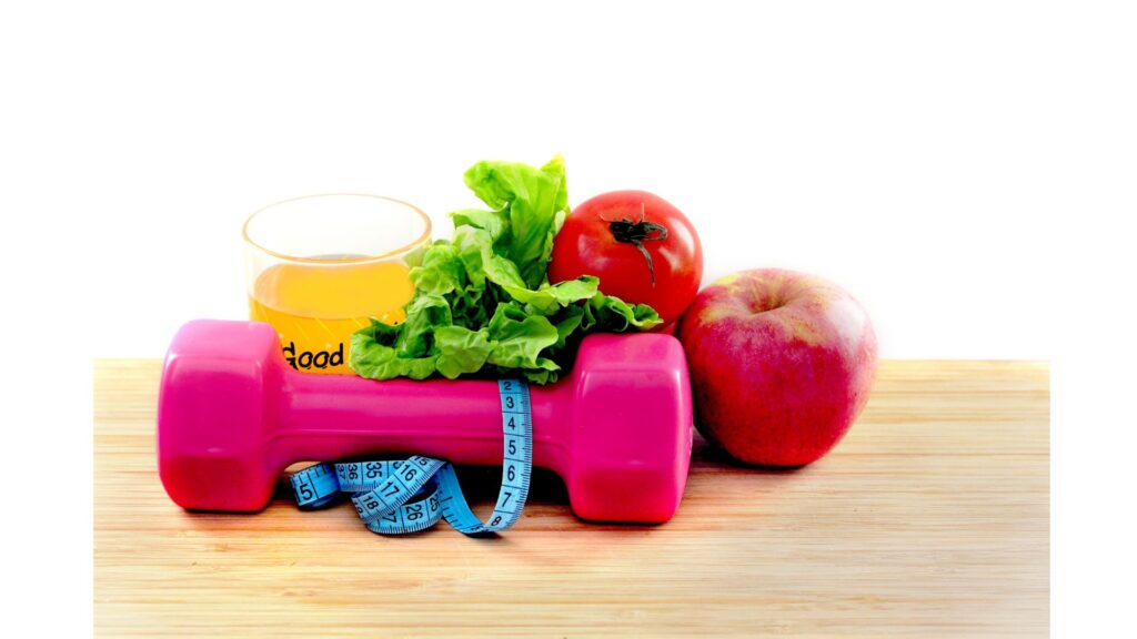 Picture of fruit and weights, showing that hypnotherapy can help you achieve your goals.