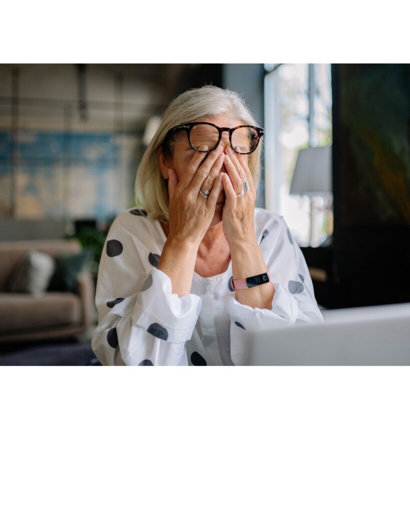 A female looking stressed and anxious, showing that hypnotherapy can help.