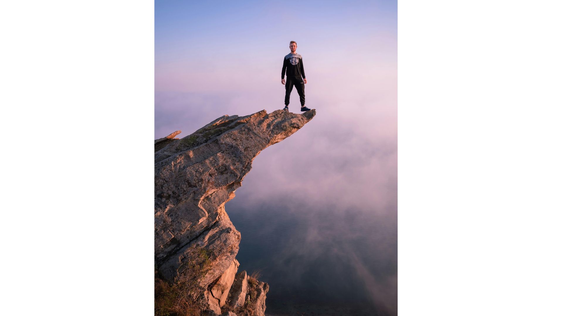 Cliff Edge A picture of a man standing on the edge of a sheer drop off a cliff, showing that hypnotherapy can help you with your fears and phobias.