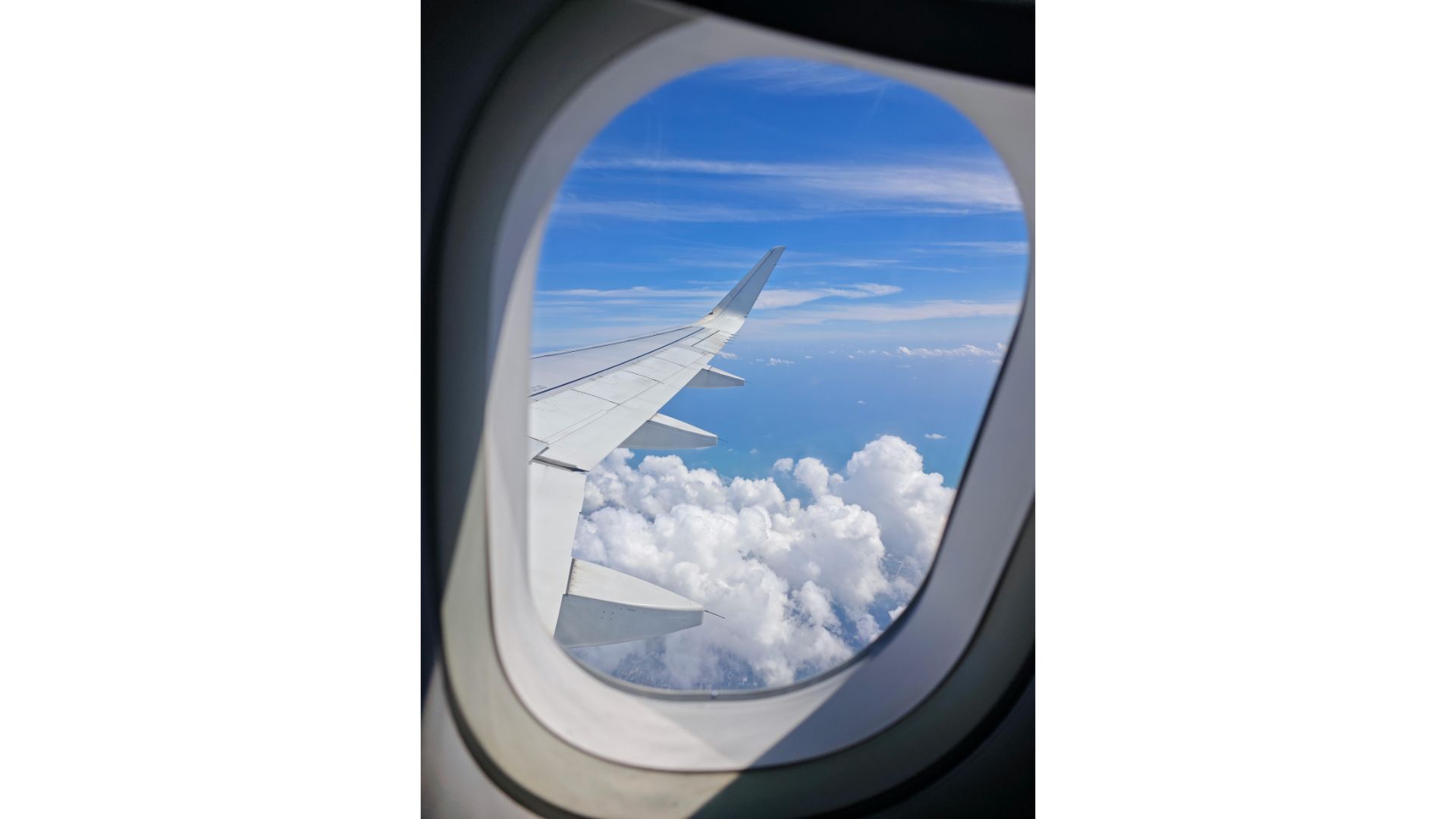 Plane Window A picture of a plane window, showing that hypnotherapy can help with phobias.