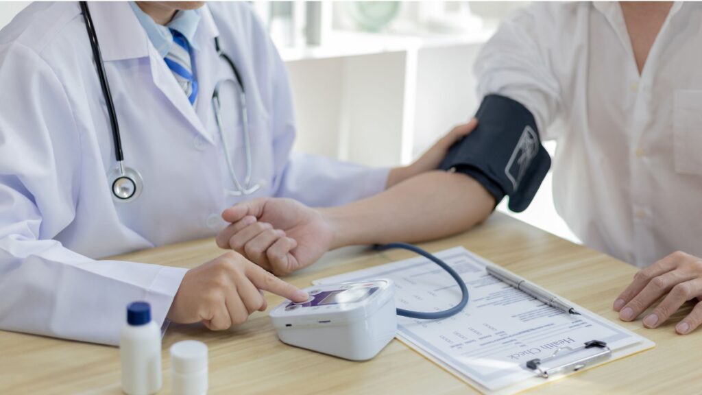 Picture of a patient having their blood pressure taken, showing how hypnotherapy may help if you suffer from 'White Coat Syndrome'.