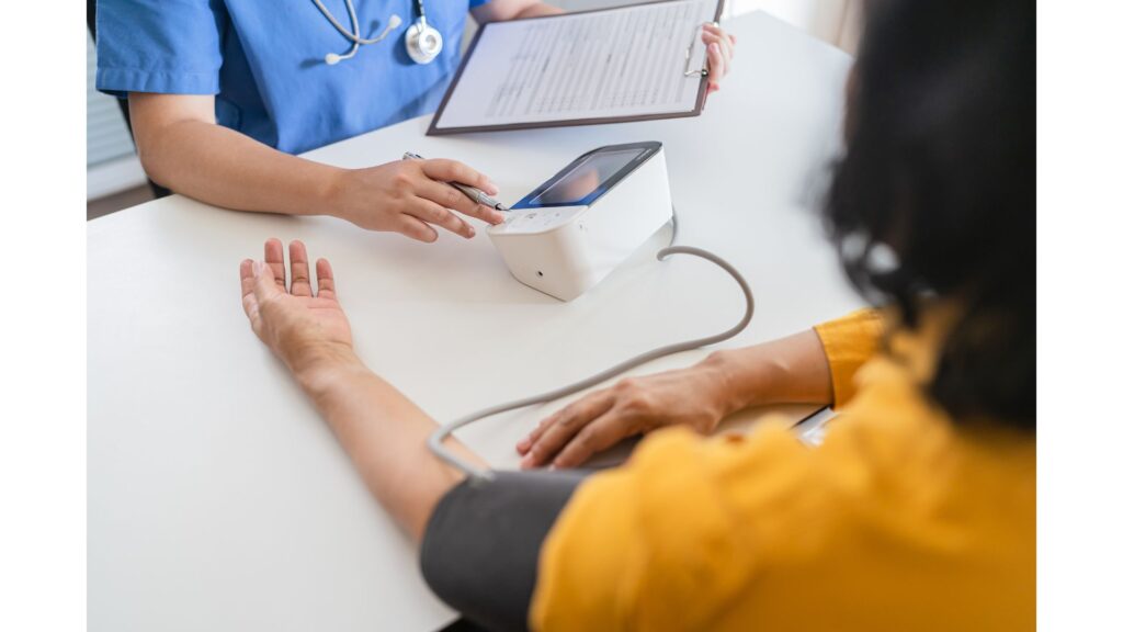 A picture of a lady having her blood pressure taken, showing that hypnotherapy may help you if your blood pressure rises just because it's being taken.