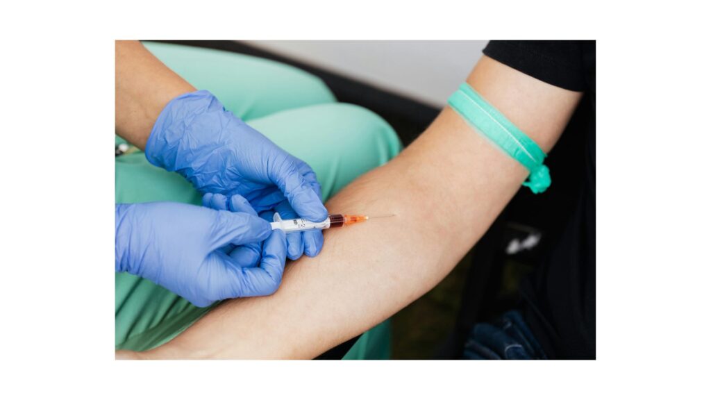 A picture of someone having blood taken, showing how hypnotherapy may help you overcome your fear of needles.