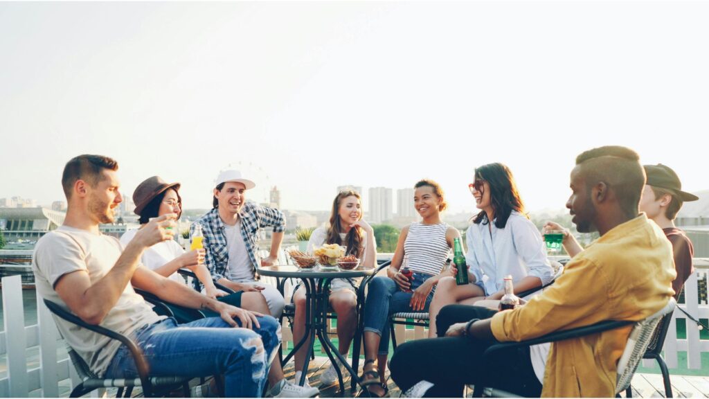 Picture of a group of people enjoying a drink outside, showing that hypnotherapy can help you enjoy new environments.