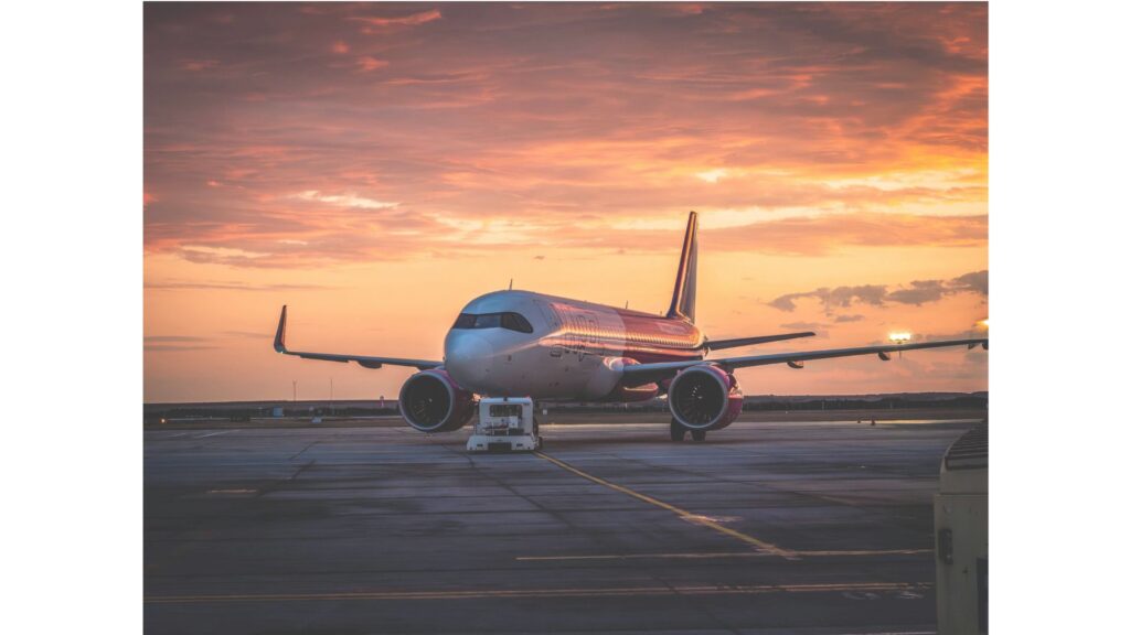 A picture of a plane at an airport, showing hypnotherapy can help you overcome the fear of flying.
