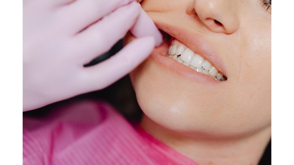 Picture of a lady having her teeth examined, showing that hypnotherapy may help you if you suffer from Bruxism.
