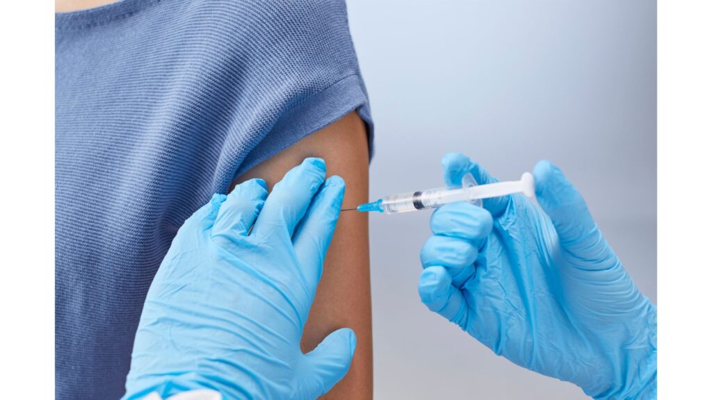 A picture of someone having a vaccination, showing how hypnotherapy could help you overcome your fear of needles.