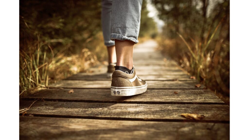 Picture of someone walking, showing that hypnotherapy can help you keep exercising.