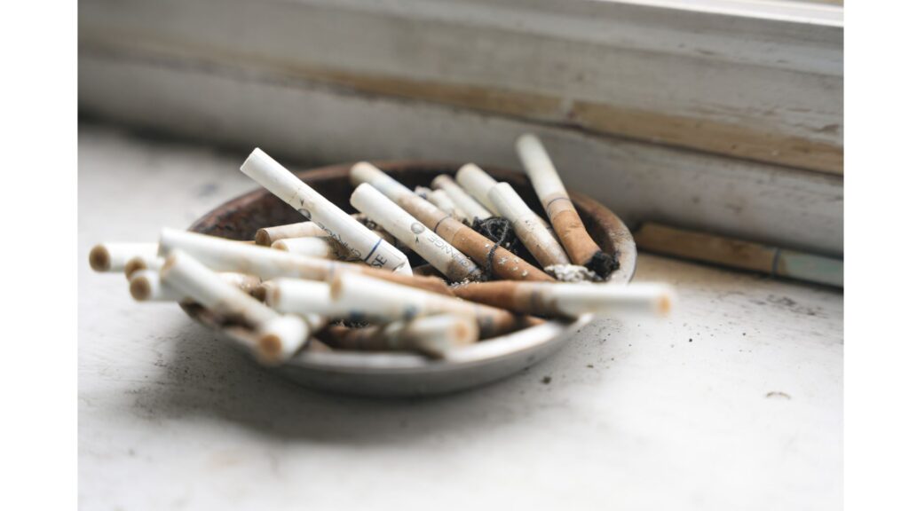 An ash tray full of half smoked cigarettes, showing that hypnotherapy could help you quit smoking or vaping.